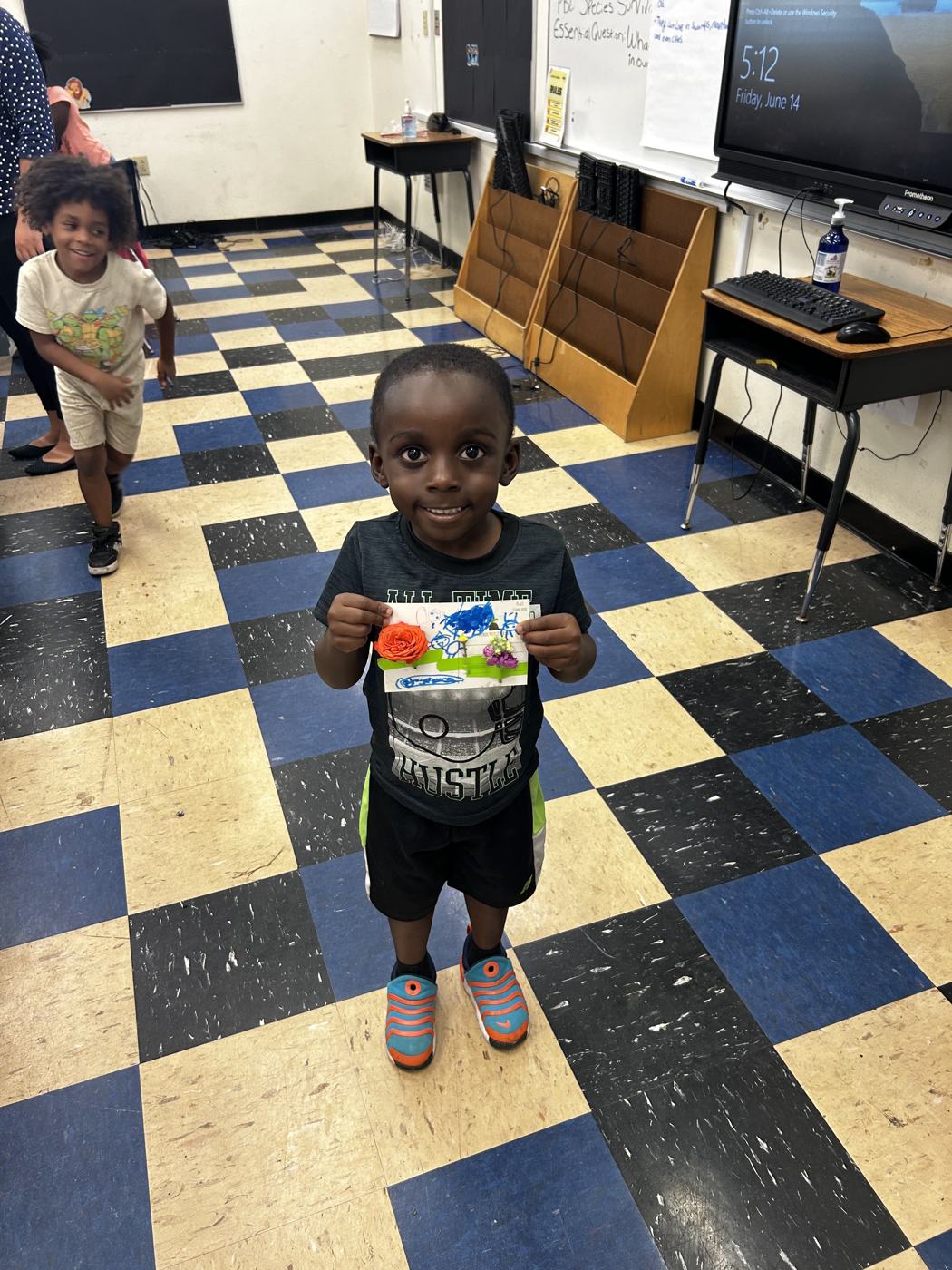 A young student standing in the classroom